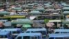 FILE - Kenyan public transport, known locally as matatu, queue to transport passengers in Nairobi, Sept. 12, 2023. 