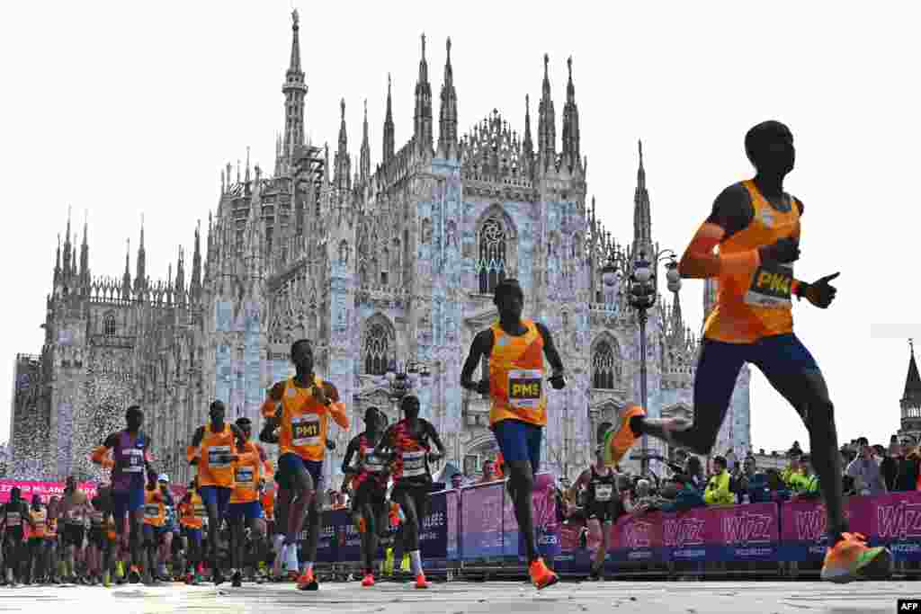 Athletes take the start of Milan's marathon at Piazza Duomo, Italy.