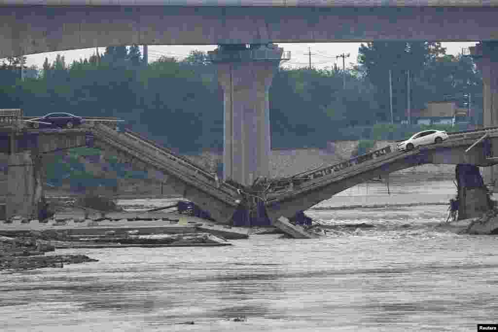A bridge is damaged after remnants of Typhoon Doksuri brought rains and floods in Beijing, China, Aug. 2, 2023.