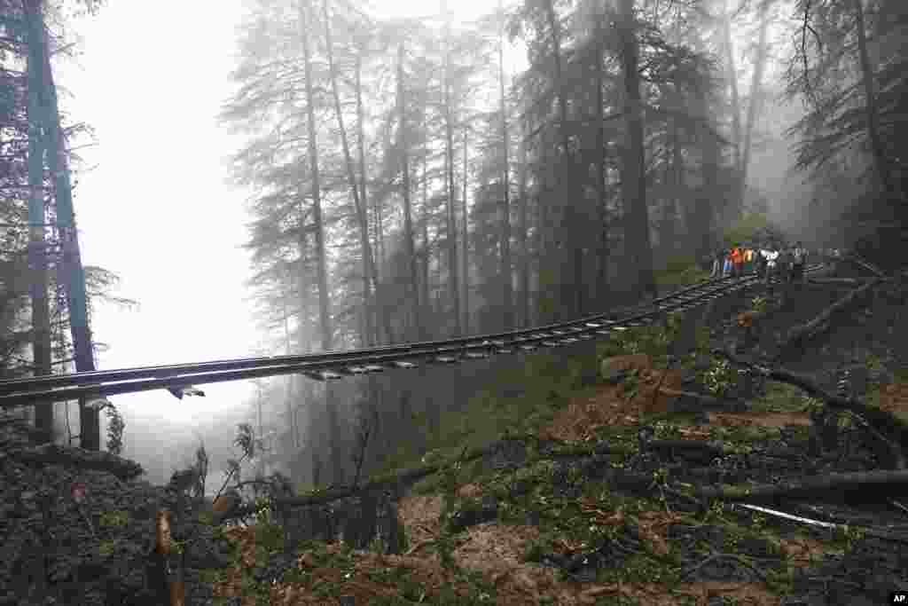 A portion of the Shimla-Kalka heritage railway track is seen washed away following heavy rainfall on the outskirts of Shimla, Himachal Pradesh state, India. 