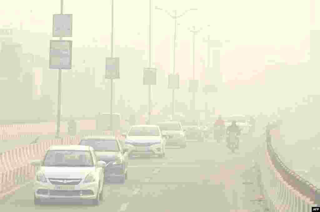 Commuters make their way through heavy smog in Amritsar, India.