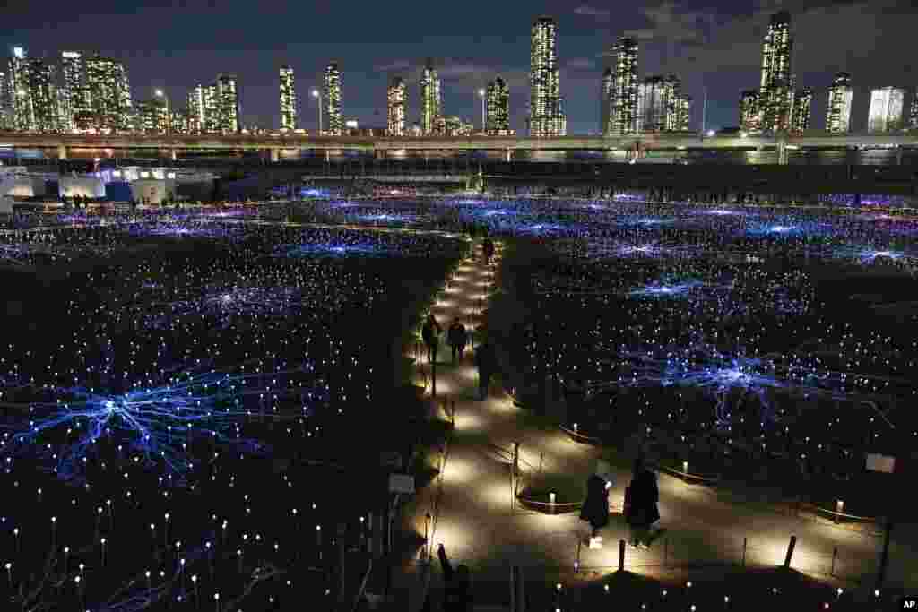 A general view shows the public art installation "Field of Light," at the Freedom Plaza near United Nations headquarters, Dec. 13, 2023, in New York.