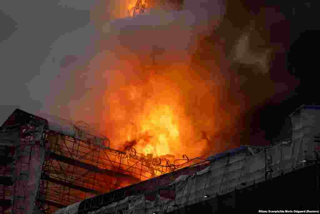 Fire burns at the Old Stock Exchange, Boersen, in Copenhagen, Denmark.