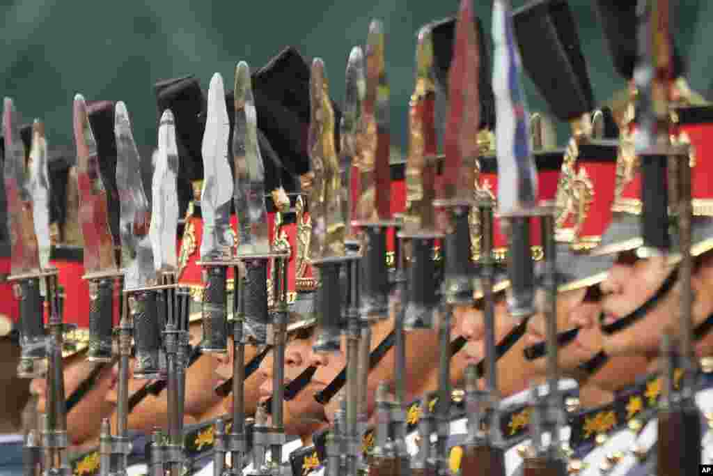Philippines' troops stand at attention during the 88th anniversary of the Armed Forces of the Philippines at Camp Aguinaldo military headquarters in Quezon city.