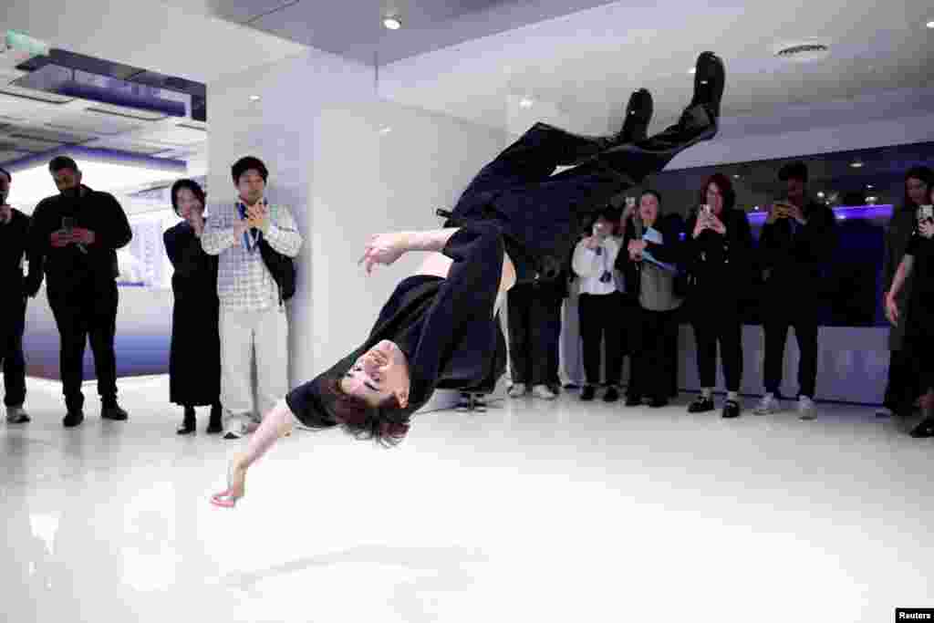 British breaker Karam Singh performs during a Reuters interview on the sidelines of the inauguration of the Samsung Galaxy innovation space on the Champs-Elysees avenue in Paris, France, April 29, 2024.