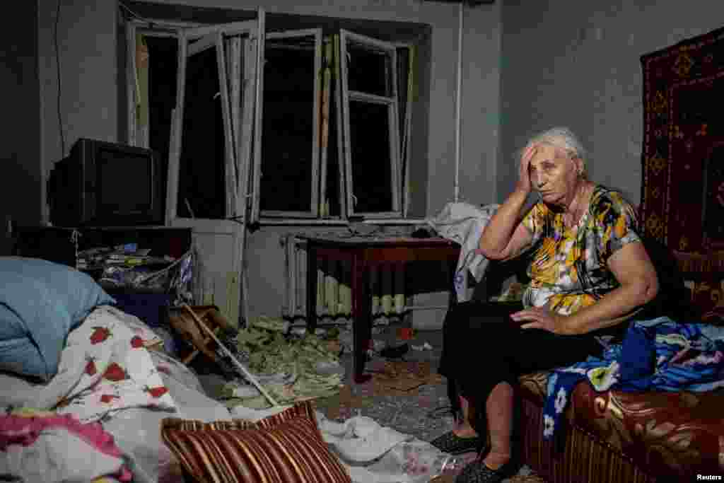 A wounded local resident is seen in her destroyed flat during a Russian missile strike in Pokrovsk, Donetsk region, Ukraine.