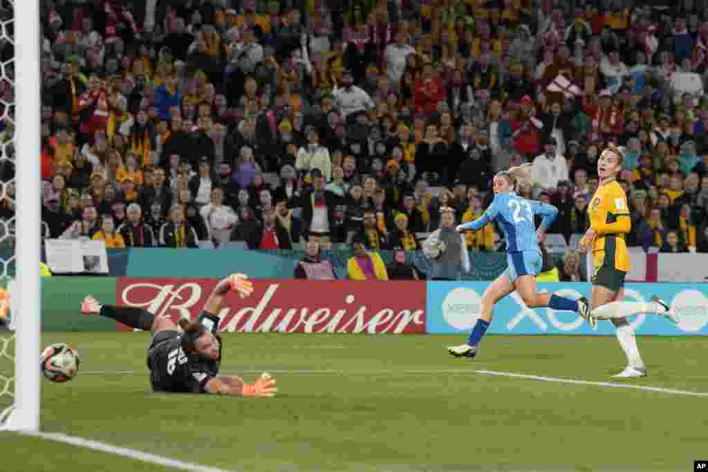Australia's goalkeeper Mackenzie Arnold fails to save the goal from England's Alessia Russo, 2nd right, during the Women's World Cup semifinal soccer match between Australia and England at Stadium Australia in Sydney.