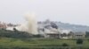 Asap membubung dari lokasi serangan udara oleh Israel di Desa Tayr Harfa, di selatan Lebanon, Sabtu, 26 April 2024. (Foto: Kawnat Haju/AFP)
