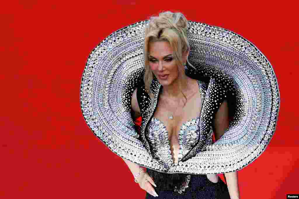 A guest poses on the red carpet during arrivals for the screening of the film "Horizon: An American Saga - Chapter 1" Out of competition at the 77th Cannes Film Festival in Cannes, France, May 19, 2024.