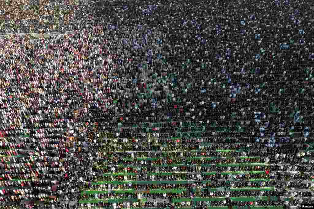 A drone view shows Albanian Muslims attending Eid al-Fitr prayers to mark the end of the holy fasting month of Ramadan, at Skanderbeg Square in Tirana, Albania.