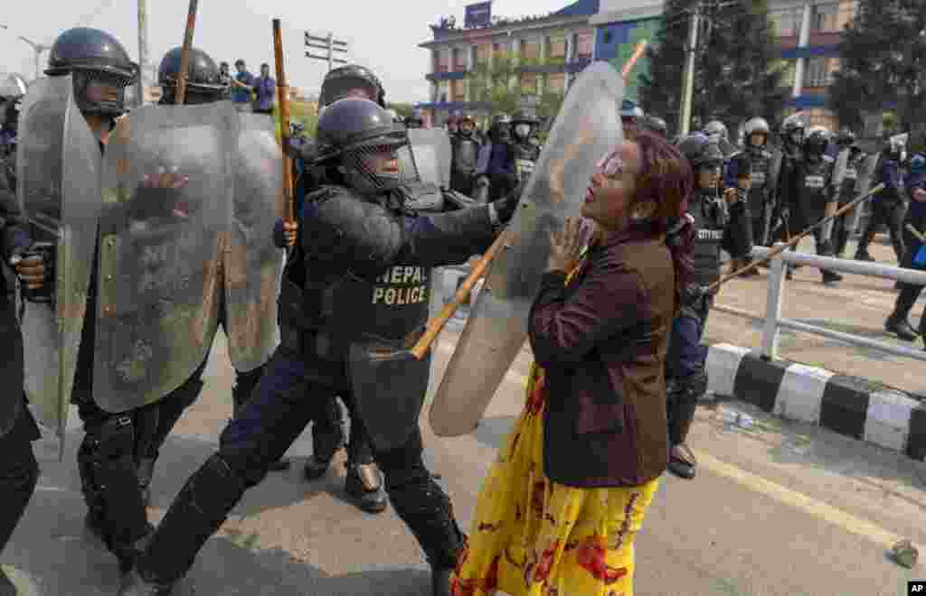 Policemen baton charge supporters of Rastriya Prajatantra Party, or national democratic party during a protest demanding a restoration of Nepal's monarchy in Kathmandu.