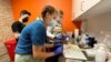 Medical staff prepare monkeypox vaccines at the Test Positive Aware Network nonprofit clinic in Chicago, July 25, 2022. 