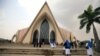 FILE - Catholic nuns are seen heading toward a church in Abuja, Nigeria, March 1, 2020.