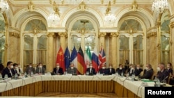 FILE - Officials wait for the start of a meeting of the JCPOA Joint Commission in Vienna, Austria, Nov. 29, 2021. (EU Delegation in Vienna/handout via Reuters)