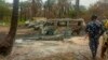 People gather at the site of an explosion at an illegal oil bunkering site in the Egbema local government area, Imo state, in southeastern Nigeria, April 24, 2022. 