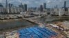 An aerial view shows a construction site for coronavirus isolation facilities and a temporary bridge linked China's Shenzhen and Hong Kong's Lok Ma Chau cities in Hong Kong, March 11, 2022.