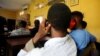  File - Men charged with public displays of affection with members of the same sex sit inside a court in Lagos, Nigeria Oct. 27, 2020.