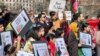 People demonstrate in front of the White House in Washington, Jan. 1, 2023, against the Afghan Taliban regime's ban of higher education for women.