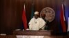 Nigerian President Muhammadu Buhari speaks during the launch of the new Nigerian currency in Abuja, Nov. 23, 2022. Buhari said, Nov. 30, 2022, the war between Russia and Ukraine is allowing arms and fighters to stream into the Lake Chad region.