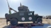 Una columna de humo se observa después de combates entre el Talibán y las fuerzas del gobierno afgano en Kandahar, en el sur de Afganistán, el 12 de agosto de 2001.