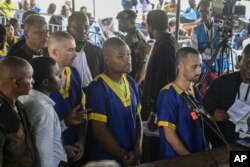 Raia wa Marekani wanaoshikiliwa DRC kutoka kushoto Tyler Thompson Jr., Marcel Malanga na Benjamin Reuben Zalman-Polun, kulia,