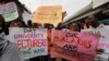 FILE - Nigeria Labour Congress members protest on the street in Lagos, Nigeria, July 26, 2022 in solidarity with the Academic Staff Union of Universities. On Oct. 14, 2022, the union said the strike, which began in February 2022, was suspended.