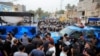 Sejumlah petugas keamanan berjaga di dekat kantor kedutaan besar Turki di Baghdad, Irak, pada 21 Juli 2022. Mereka mengamankan aksi demo menyusul serangan di Dohuk, Irak, di mana pemerintah Irak menyalahkan Turki atas serangan tersebut. (Foto: Reuters/Thaier Al-Sudani)