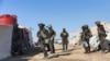 Pripadnici snaga Kurdske narodne zaštitne jedinice u Siriji (YPG) izvode bezbednosnu operaciju u kampu Al Hol, pod kurdskom kontrolom, 28. marta 2021. (AFP PHOTO/HO/YPG)