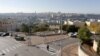 An ultra-Orthodox Jewish man walks in Ramat Shlomo, a religious Jewish settlement in an area of the occupied West Bank, in East Jerusalem, claimed by both Israel and Palestinians, December 18, 2012.