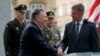 U.S. Secretary of State Mike Pompeo, front left, shakes hands with Czech Republic's Foreign Minister Tomas Petricek, right, during a ceremony at the General Patton memorial in Pilsen near Prague, Czech Republic, Aug. 11, 2020.