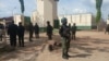 Security officers stand guard at the Kuje prison in Abuja, July 6, 2022, while search- and-rescue operations continued to recapture hundreds of inmates released by gunmen the night before. (Timothy Obiezu/VOA)