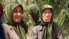 FILE - Members of the Mujahedeen-e-Khalq organization inside the Liberty refugee camp in Baghdad, Iraq. 