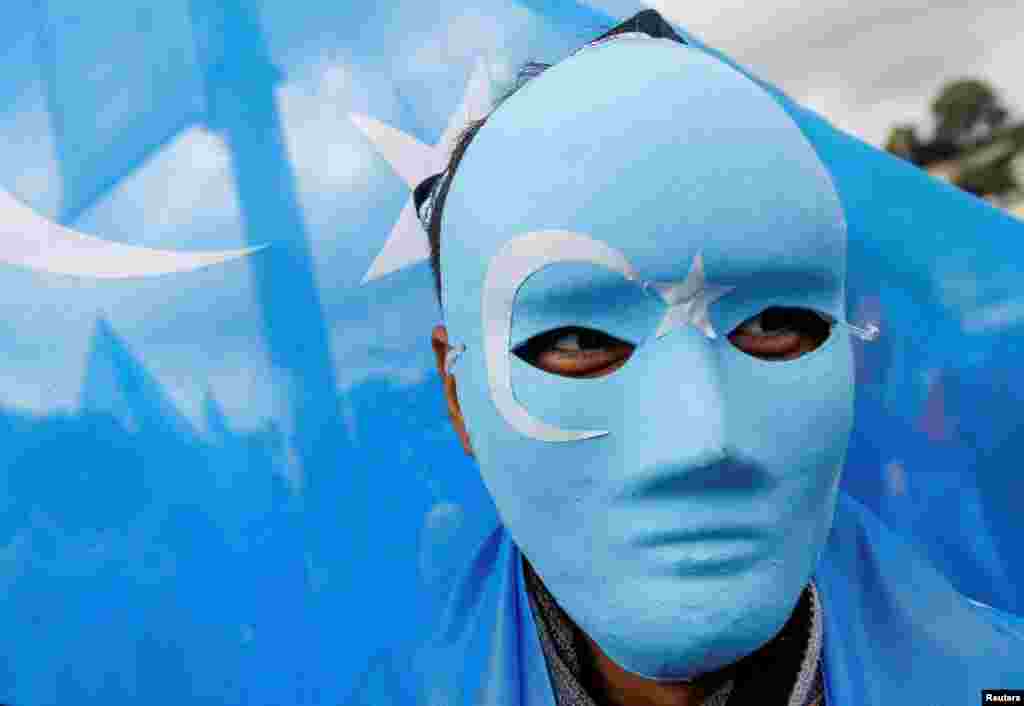 Ethnic Uyghur demonstrators take part in a protest against China, in Istanbul, Turkey.