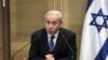 Israel's Prime Minister Benjamin Netanyahu (L) speaks during a joint news conference with Shaul Mofaz (not seen), head of the Kadima party which join Netanyahu's rightist coalition, at parliament in Jerusalem, May 8, 2012.