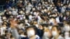 Baseball fans cheer their teams during a game between Kiwoom Heroes and Doosan Bears in Seoul, South Korea, Nov. 1, 2021. 