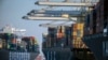 FILE - Container ships are seen at the Port of Savannah, Georgia, Sept. 29, 2021. A World Trade Organization arbitrator has decided that China can impose tariffs on imports from the United States totaling up to $645 million a year.