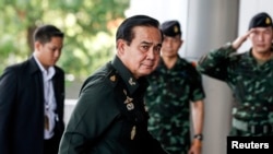 Thai Army chief General Prayuth Chan-Ocha arrives for a meeting to discuss Thailand's 2015 national budget, June 13, 2014.