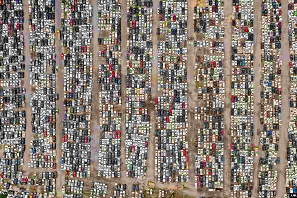 This aerial photo shows vehicles damaged by floods in July at a parking lot, some of which will be discarded, in Zhengzhou in China's central Henan province, Aug. 10, 2021.