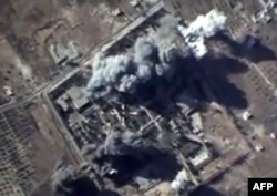 FILE - A video grab made on October 12, 2015, shows an image taken from a footage made available on the Russian Defence Ministry's official website, purporting to show explosions after airstrikes carried out by Russian air force on what Russia says was an Islami