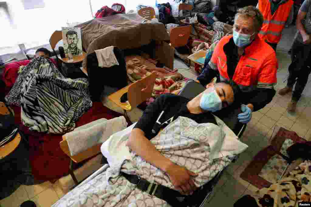 Omor Belil, an asylum seeker who is among several hundred migrants requesting to be regularized by the Belgian government to have access to healthcare, is transported to a hospital as he takes part in a hunger strike for more than 7 weeks at the ULB University campus in Brussels.