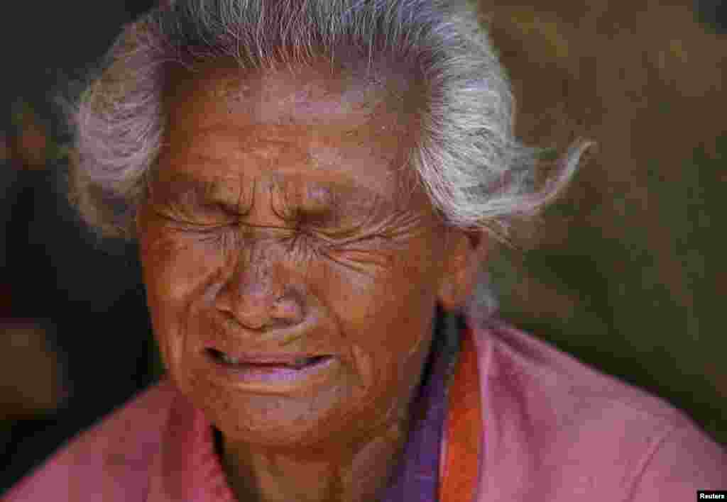 A woman mourns her granddaughter, who died in Saturday's earthquake in Bhaktapur, Nepal.