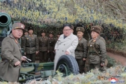 North Korean leader Kim Jong Un visits the Changrindo defensive position on the west front, in this undated picture released by North Korea's Central News Agency (KCNA), Nov.25, 2019.