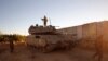 Tentara Israel ditempatkan di dekat pemukiman Israel utara Shtula di sepanjang perbatasan dengan Lebanon, 19 Mei 2021. (Foto: AFP)