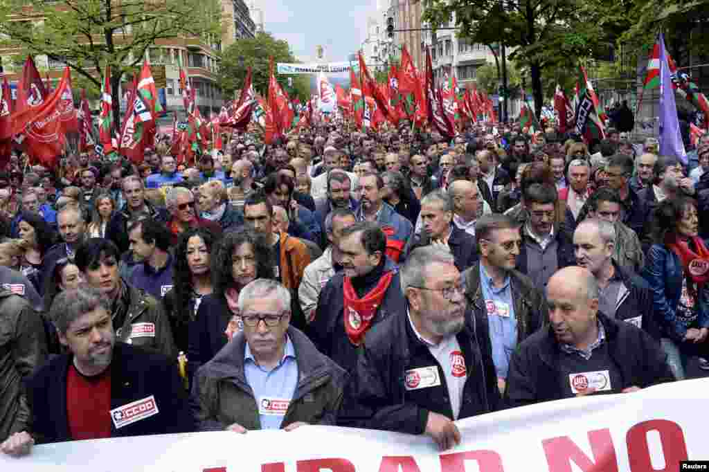 Ignacio Fernandez Toxo (2nd L) and Candido Mendez (2nd R), general secretaries of Spain's leading trade unions CCOO and UGT, march as they are flanked by Basque CCOO and UGT leaders Unai Sordo (L) and Raul Arza during May Day celebrations in Bilbao.