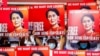 Manifestantes portan carteles con la efigie de la exlíder de facto de Myanmar Aung San Suu Kyi en una protesta en Naypyitaw, el 15 de febrero de 2021.