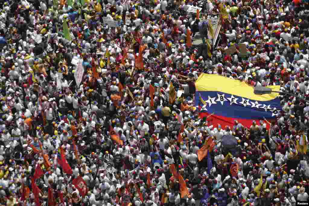 Opposition supporters march protest against President Nicolas Maduro's government in Caracas Feb. 22, 2014.