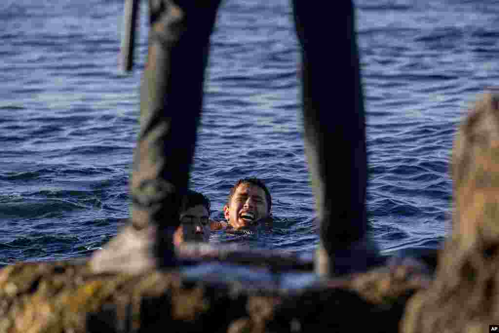 A Spanish civil guard waits for migrants at the Spanish enclave of Ceuta, near the border of Morocco and Spain. Spanish officials say the migrant crisis was triggered by Madrid's decision to provide medical treatment to the militant boss of the Polisario