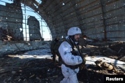 FILE - Ukrainian servicemen are seen at their position on the front line near the government-held town of Avdiyivka, Ukraine, Feb. 9, 2017.