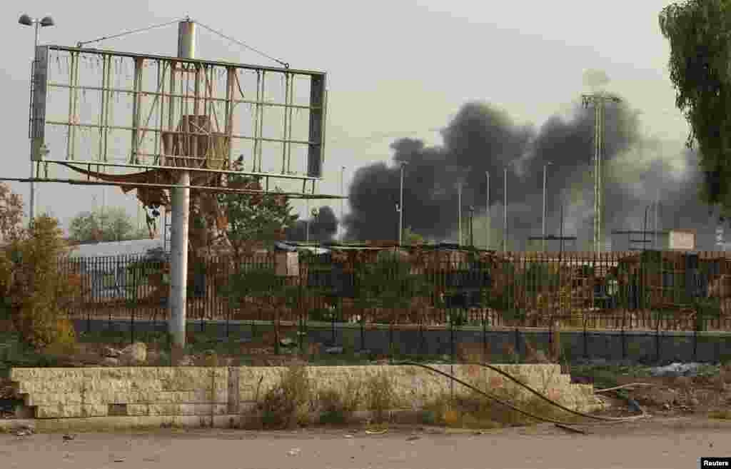 Smoke rises in Base 80 area of Aleppo, Nov. 10, 2013.