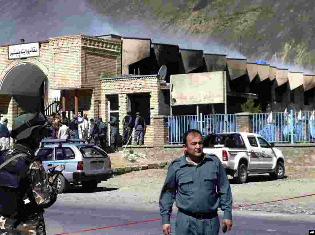 A police officer at the scene of an attack on a government compound in Panjshir, Afghanistan, May 29, 2013.